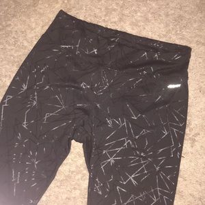 Black leggings with silver cross detail